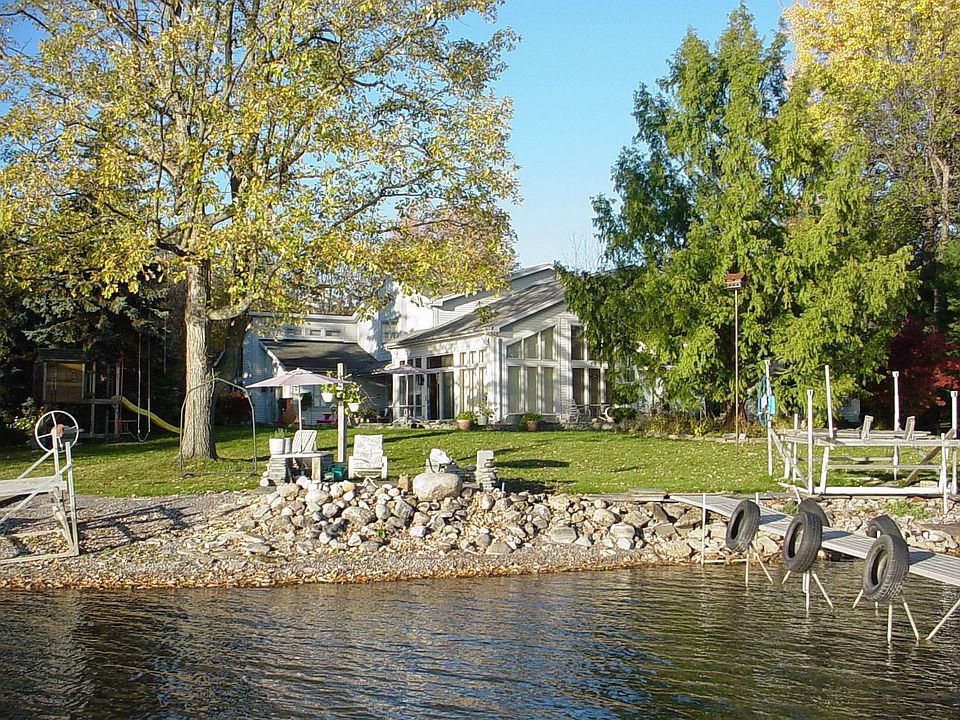 143' of Level Lake Frontage and 5000 square foot 1st floor Contemporary home