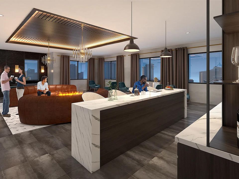 8th-floor sky lounge with gathering space, bar area, and sweeping views at Modera Encore apartments in Tampa.