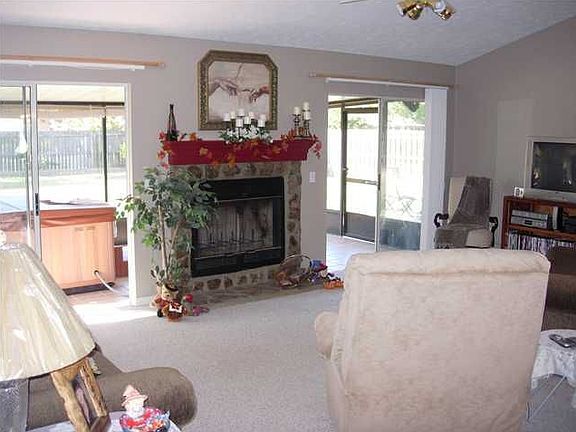 wood burning fireplace and vaulted ceilings