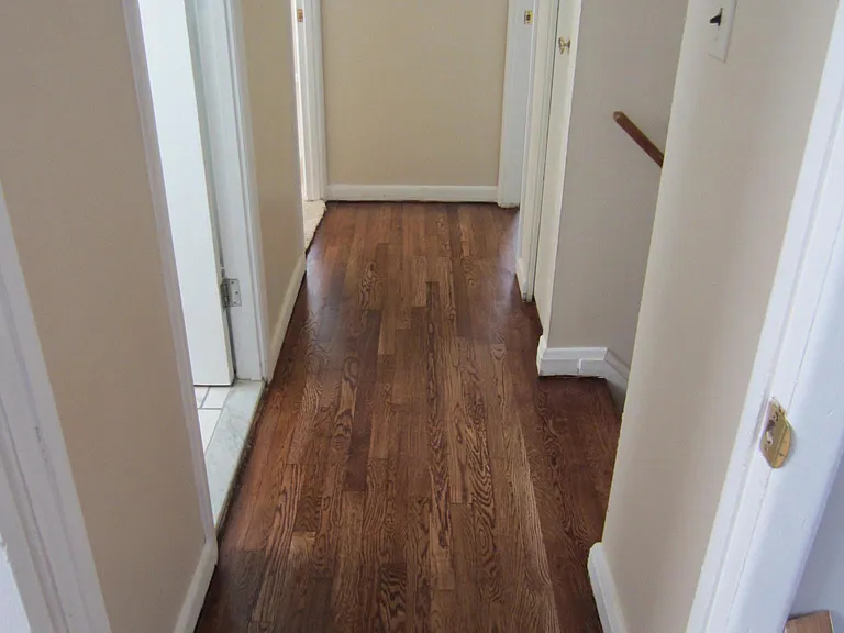 Upper level hall that leads to the bedrooms, bath, linen closet and the stairway leading to the main level. Note: there is a platform separating both stairs.