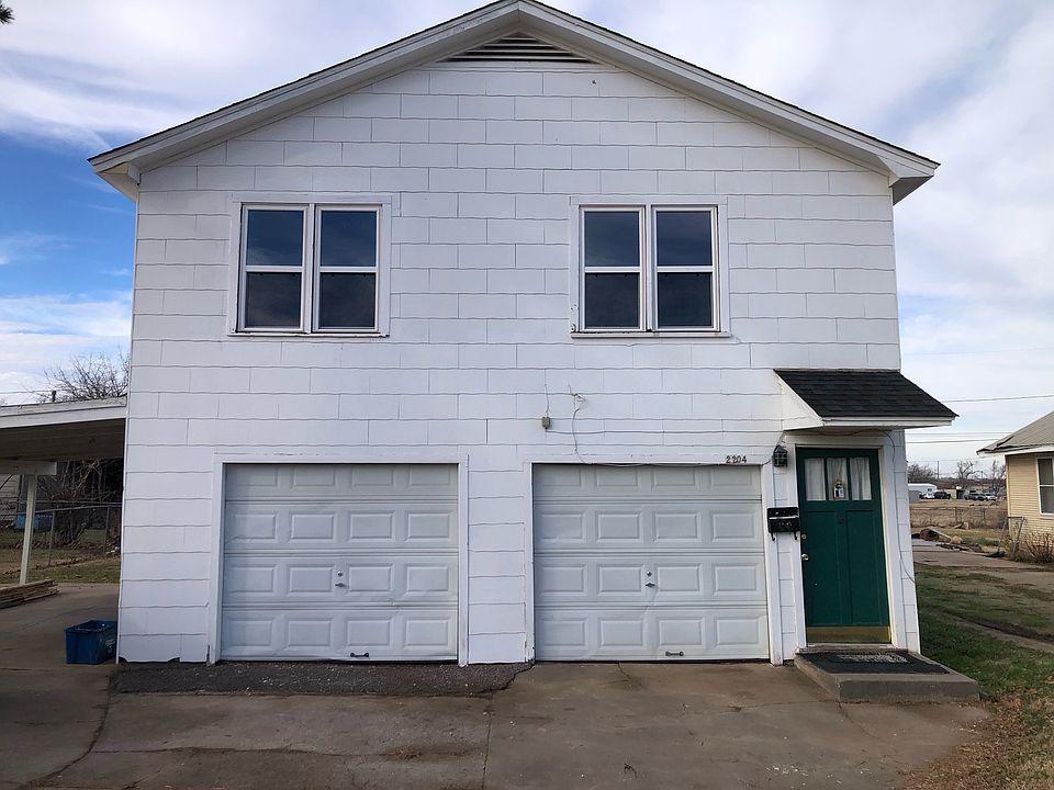 The garage on the right goes with the apartment. Too small for most cars but good for storage