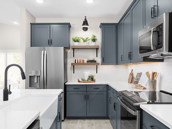 Kitchen with stylish floating shelves