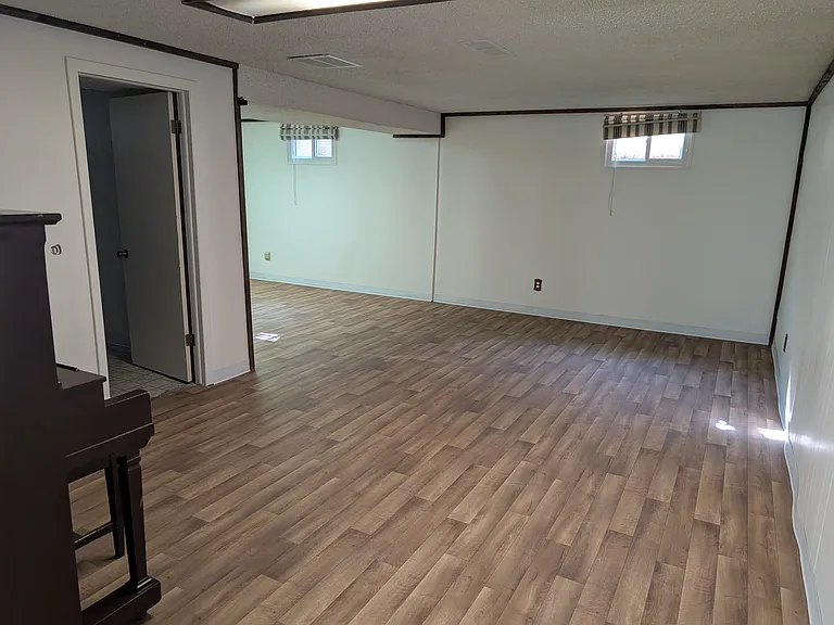 spacious area in basement by laundry room