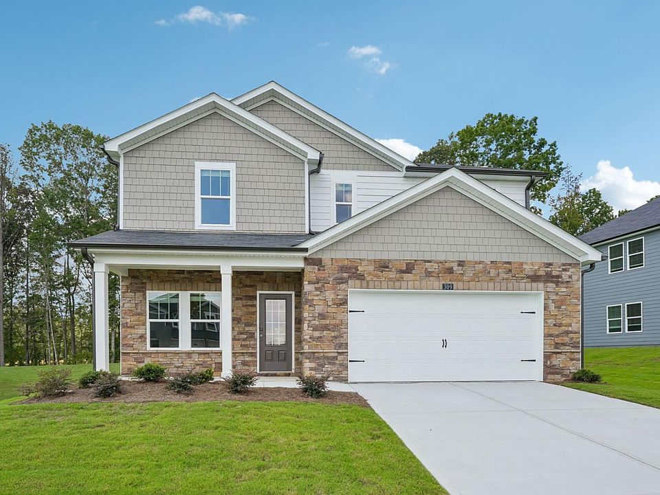 The Dakota floorplan with Elevation J modeled at Northwoods at Mirror Lake.