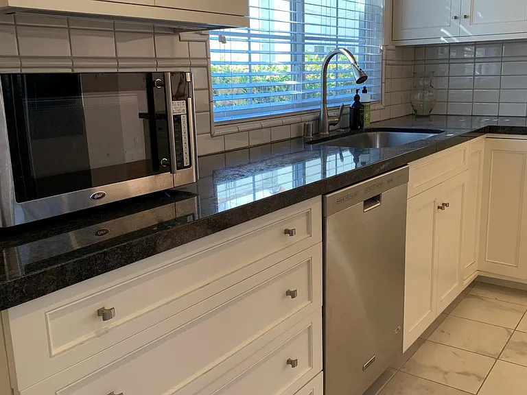 Dishwasher, microwave and southern-facing kitchen window