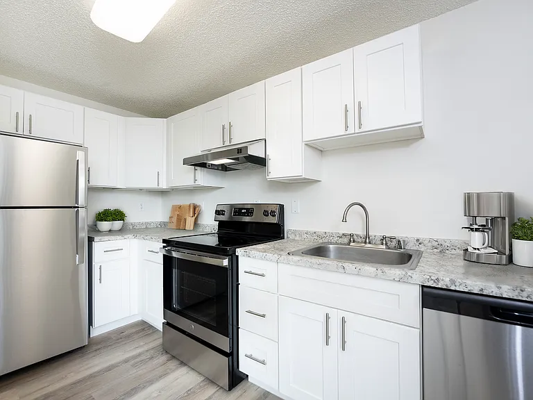 Modern Tacoma apartment kitchen with upgraded finishes and stainless appliances. Modern Tacoma apartment kitchen with upgraded finishes and stainless appliances.