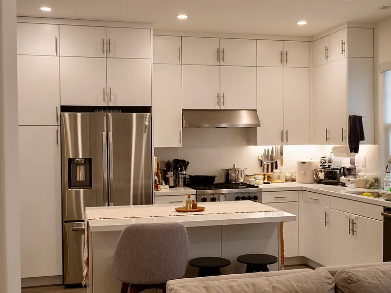 Upgraded Luxury Kitchen: Equipped with a premium stainless steel suite including a high-end Bertazzoni range/oven, upgraded powerful hood, Bosch dishwasher & microwave, and a spacious Samsung fridge/freezer. Perfect for entertaining!