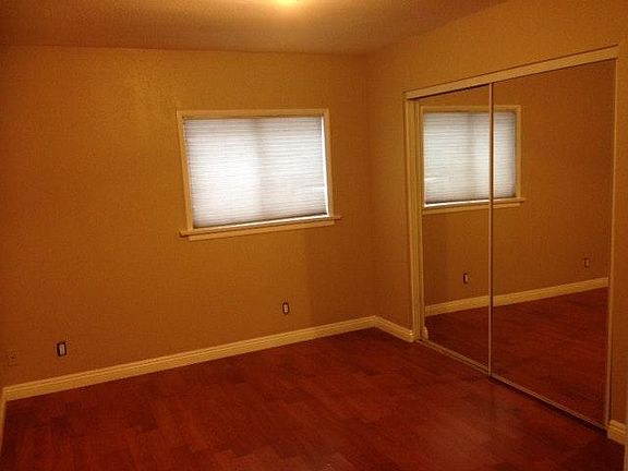 Bedroom with wood laminate flooring