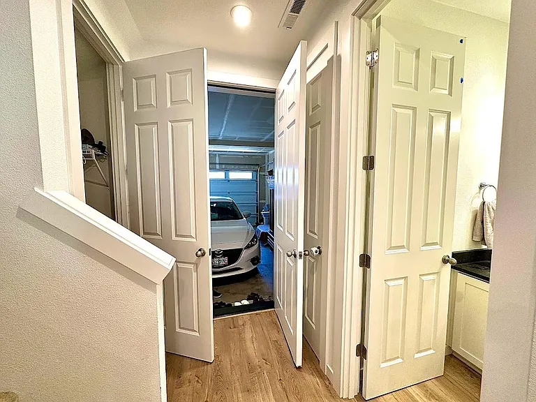 First Floor - Bathroom, Storage room, Coat hanging room and Garage doors