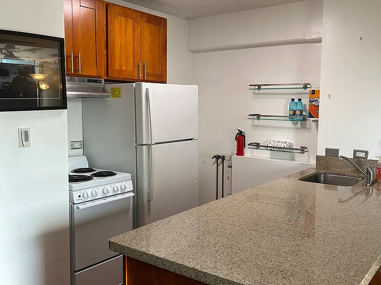 Kitchen with all appliances and pots/pans, dishes, utensils, cooking utensils.