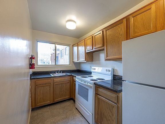 Wood Kitchen Cabinets with White Appliance Finish