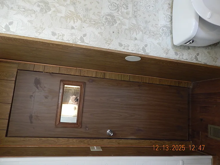 Back of bathroom door - Photo taken sideways to attempt to show whole door.