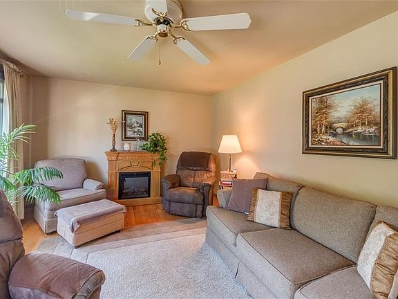 Living room with many ways to arrange your furniture.  Beautiful original hardwoods.