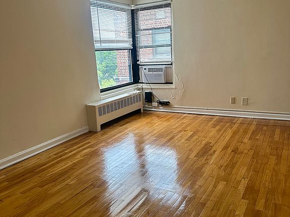 Sun filled living room with AC unit