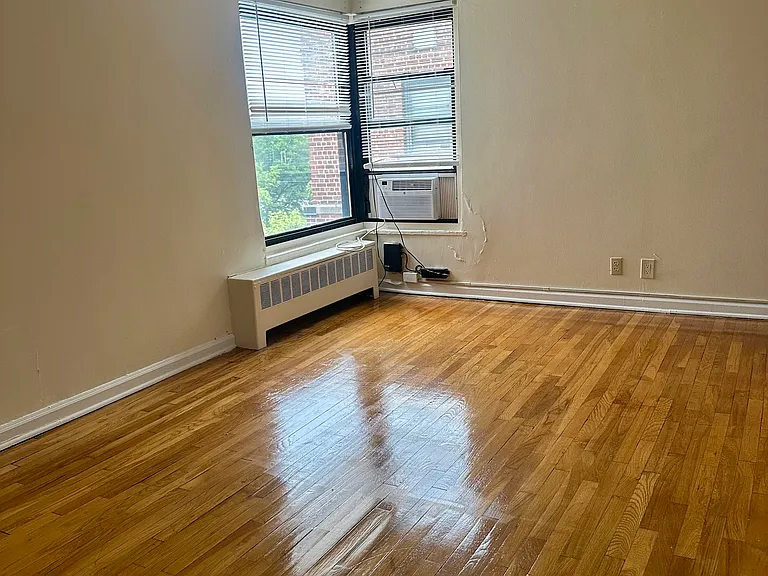 Sun filled living room with AC unit