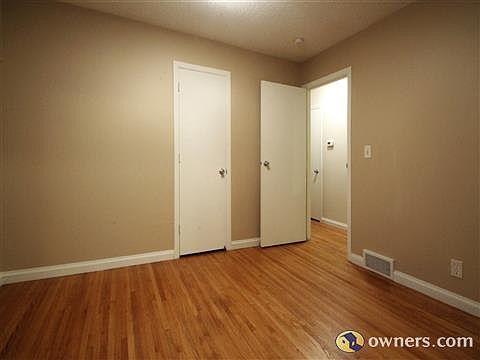 Main floor bedrooms feature refinished hardwood floors.