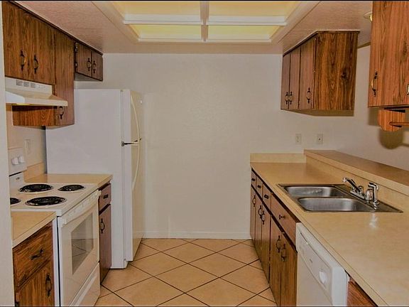 Kitchen with fridge, stove, and dishwasher