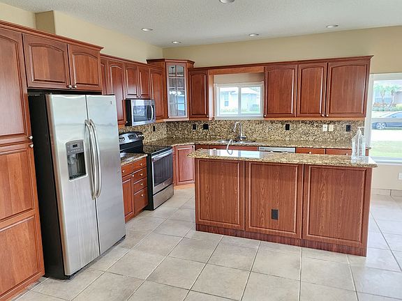 4th image of 6031 NW Flair Ct