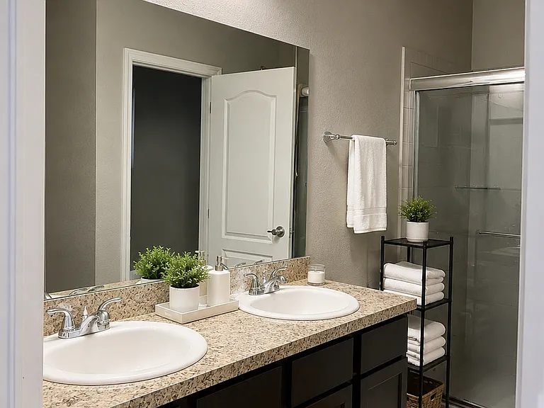master restroom, double sinks, toilet is hidden, with its own small room, has a walk-in shower and a tub for baths on the side.