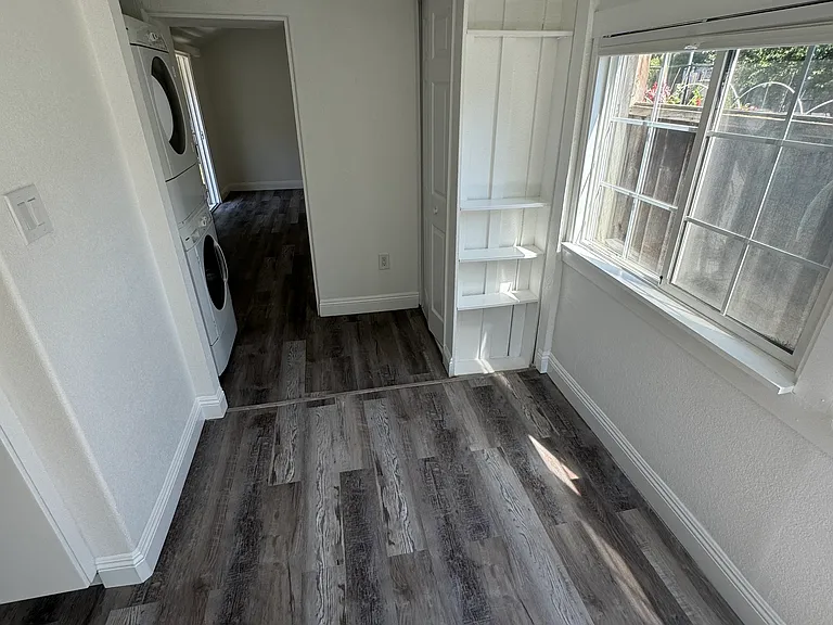 View from nook or washer/dryer & linen cabinet/storage space.
