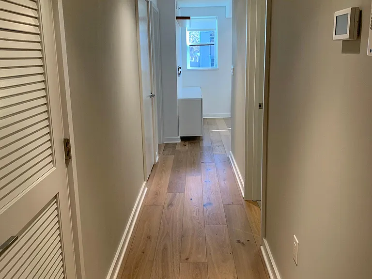Hallway with laundry clsoet to the left