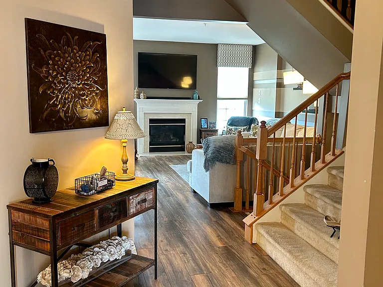 1st floor hallway leads to 2nd floor and lower level finished basment. Large family room with gas fireplace