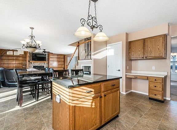 Center island w/ breakfast bar. Open floor plan.