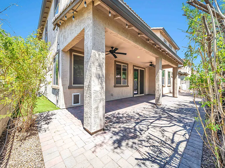 Backyard has lights, two fans and long enclosed patio