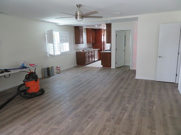 Open concept kitchen dining area and living room