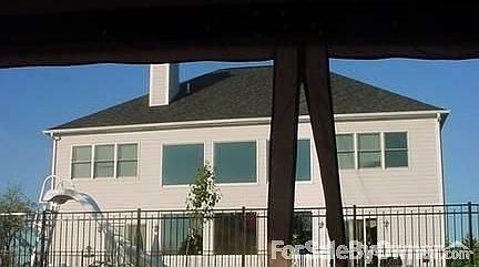 2007 rear view in summer : Windows-to the left..M. B.-windows in the back great room-bedroom-windows