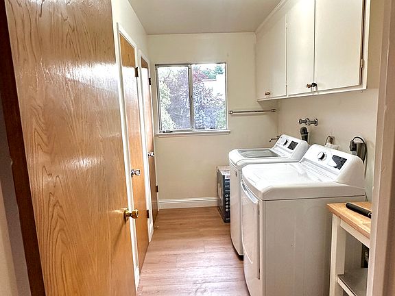Utility Room with Washer, Dryer, Pantry and half bath