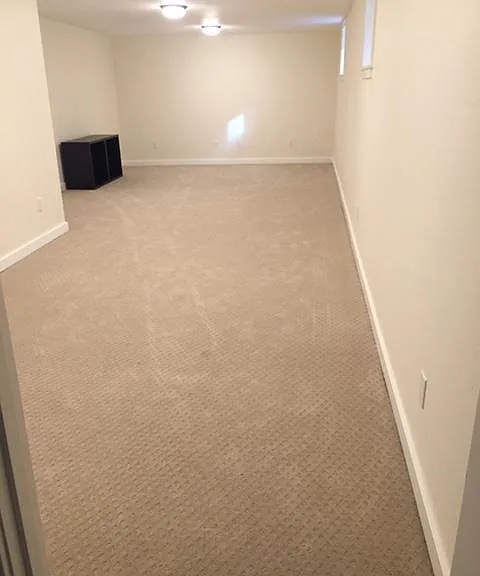 Large basement media room with access to attached garage
