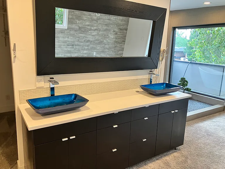 His and Her sinks with tons of storage. Commercial wall mounted hair dryer.