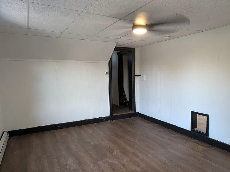 Living room facing main entrance hallway.