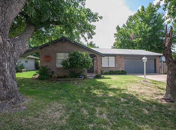 Mature trees shade the yard
