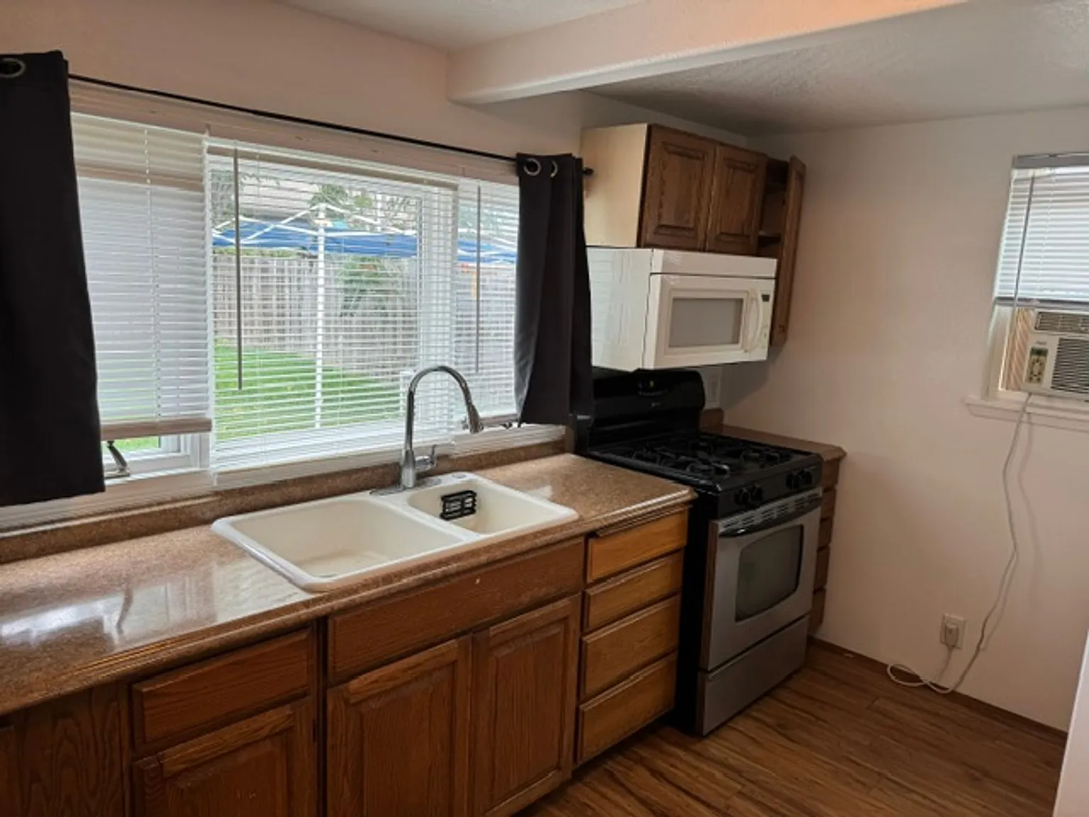 Bright & Updated Studio One-Level Living with Landscaping Included! — Photo 3