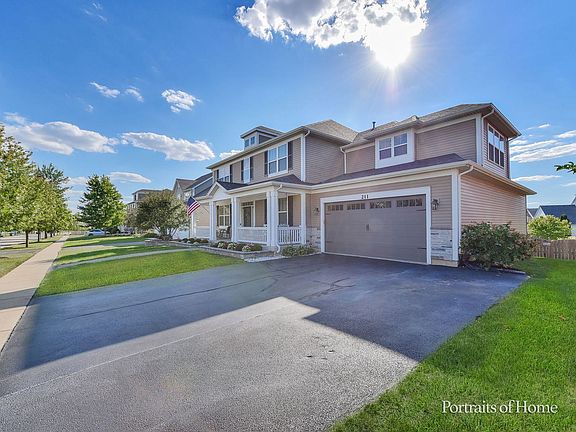 3 CAR TANDEM GARAGE!! Additional width added to Driveway and New Garage Door.