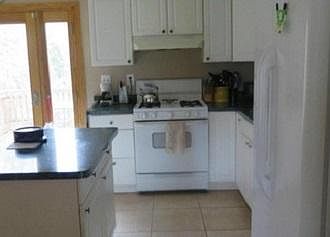 Kitchen. Stove/Oven has been upgraded w/ stainless steel appliance.