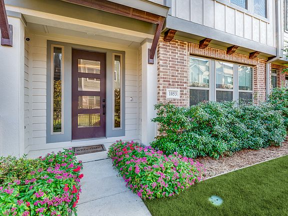 Beautifully landscaped front yard with lush healthy green grass