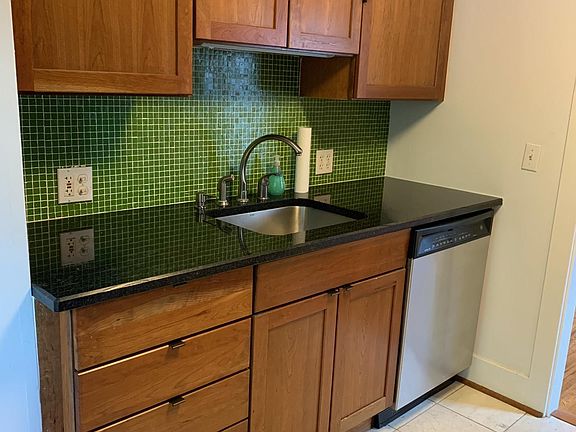 Updated kitchen with black granite counters