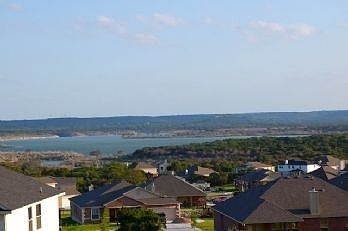Backyard and Front Porch has view of lake