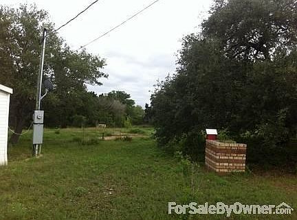 Looking North East to the back yard
						:
						Right, you can see one of the BBQ pits remaining from the park days