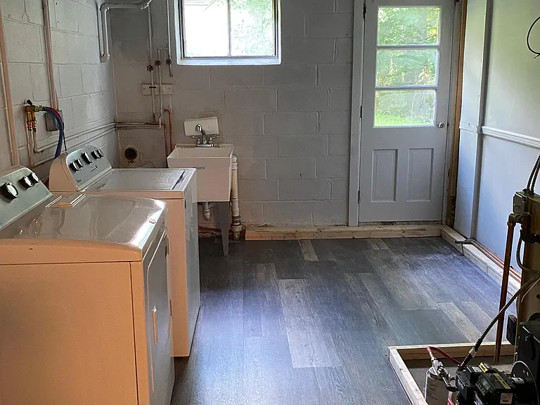New Flooring and freshly painted laundry room/utility room (new boiler and hot water heater)