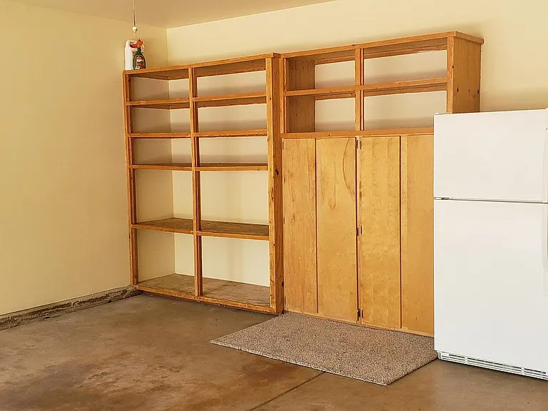 Shelves and refrigerator in garage
