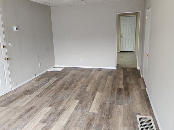 Living room view towards bedroom and kitchen