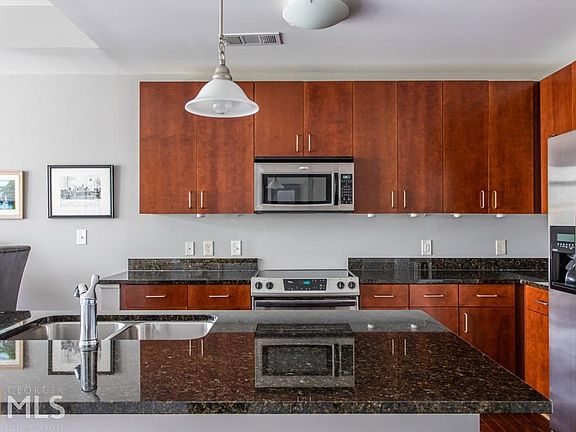 5th image of 711 Cosmopolitan Dr NE Unit 702