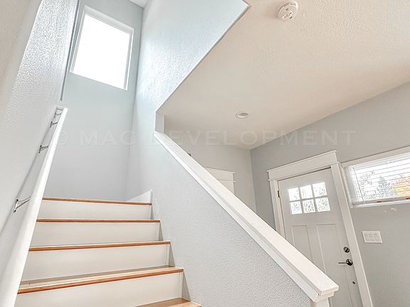 Front Door, Tiled Entryway, Coat Closet, Staircase with Bamboo Flooring
