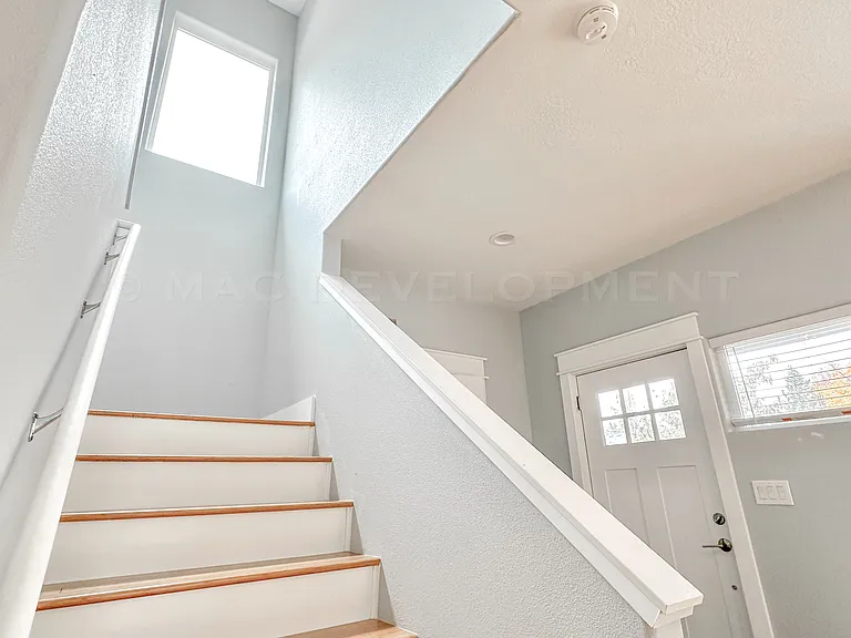 Front Door, Tiled Entryway, Coat Closet, Staircase with Bamboo Flooring