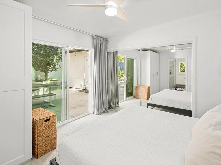 Master bedroom with sliding doors to the backyard