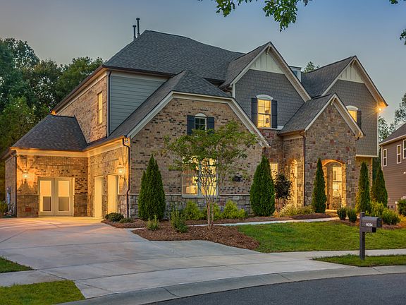 Townsend Exterior 6 features stone, brick, shakes and covered front door